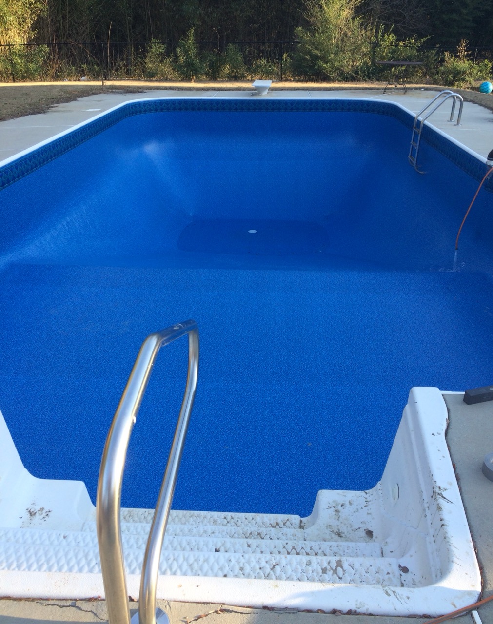 Same swimming pool with a bright new blue vinyl liner installed by Pool People